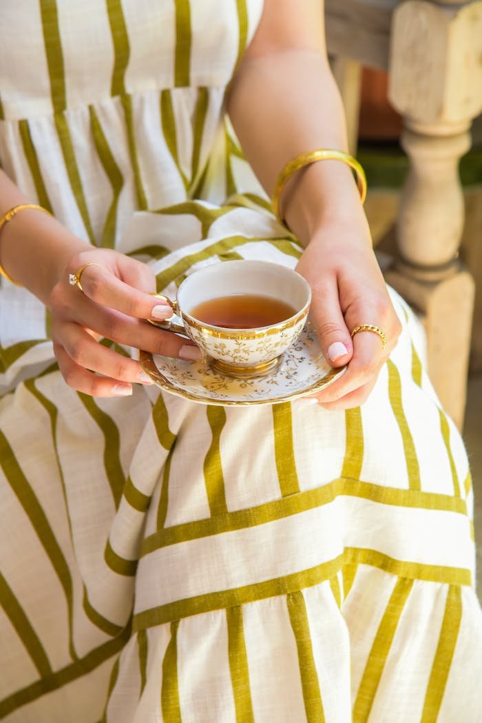 Person Holding Ceramic Teacup